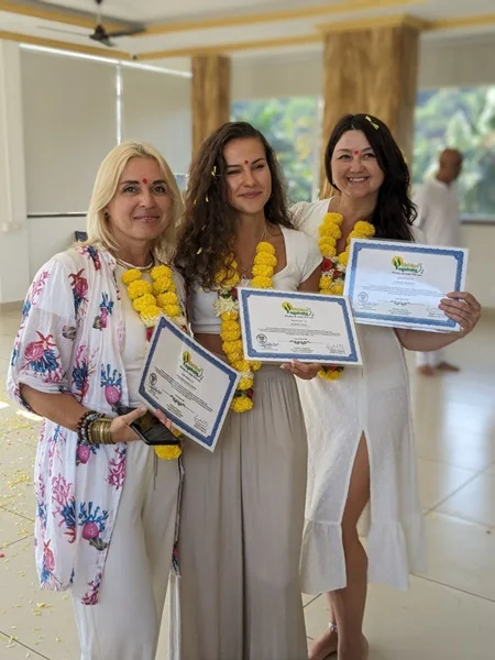 Yoga students receiving certification after completing 100 Hour YTTC