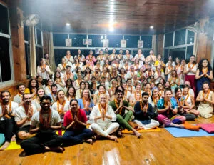 Large Group of Yoga Teacher Training Graduates Celebrating Certification at Rishikesh Yogshala