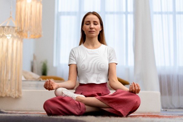 woman practicing yoga at home