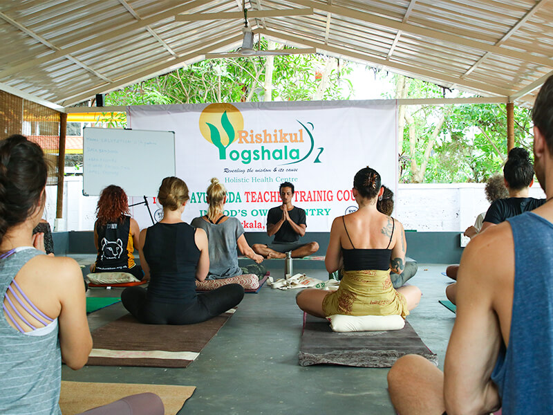 Yoga students attending a teacher training session at Rishikul Yogshala