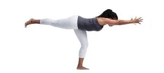 Woman balancing in Warrior III Pose (Virabhadrasana III