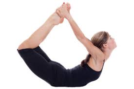 Woman performing Dhanurasana (Bow Pose)