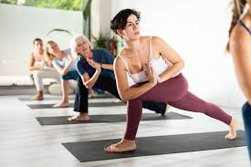 Group of people practicing Hatha Yoga