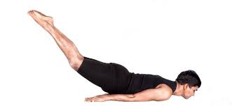 Person performing the Advanced Locust Pose