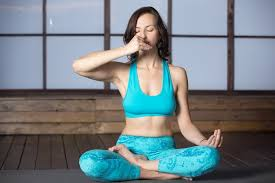 Woman Practicing Pranayama at Yoga Retreat – Breathwork for Inner Peace and Wellness