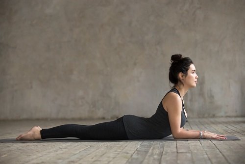 Women Practicing Salambha Bhujangasana for Better Blood Circulation