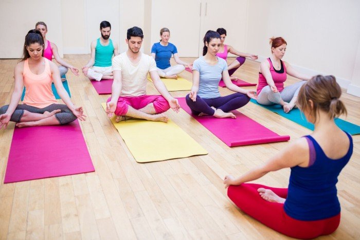 Group of people practicing meditation together