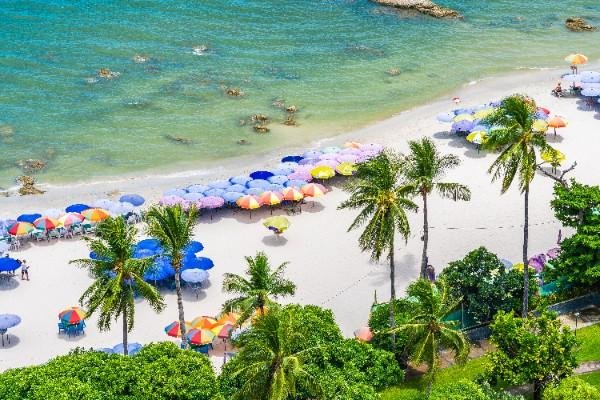 Tropical beach with colorful umbrellas